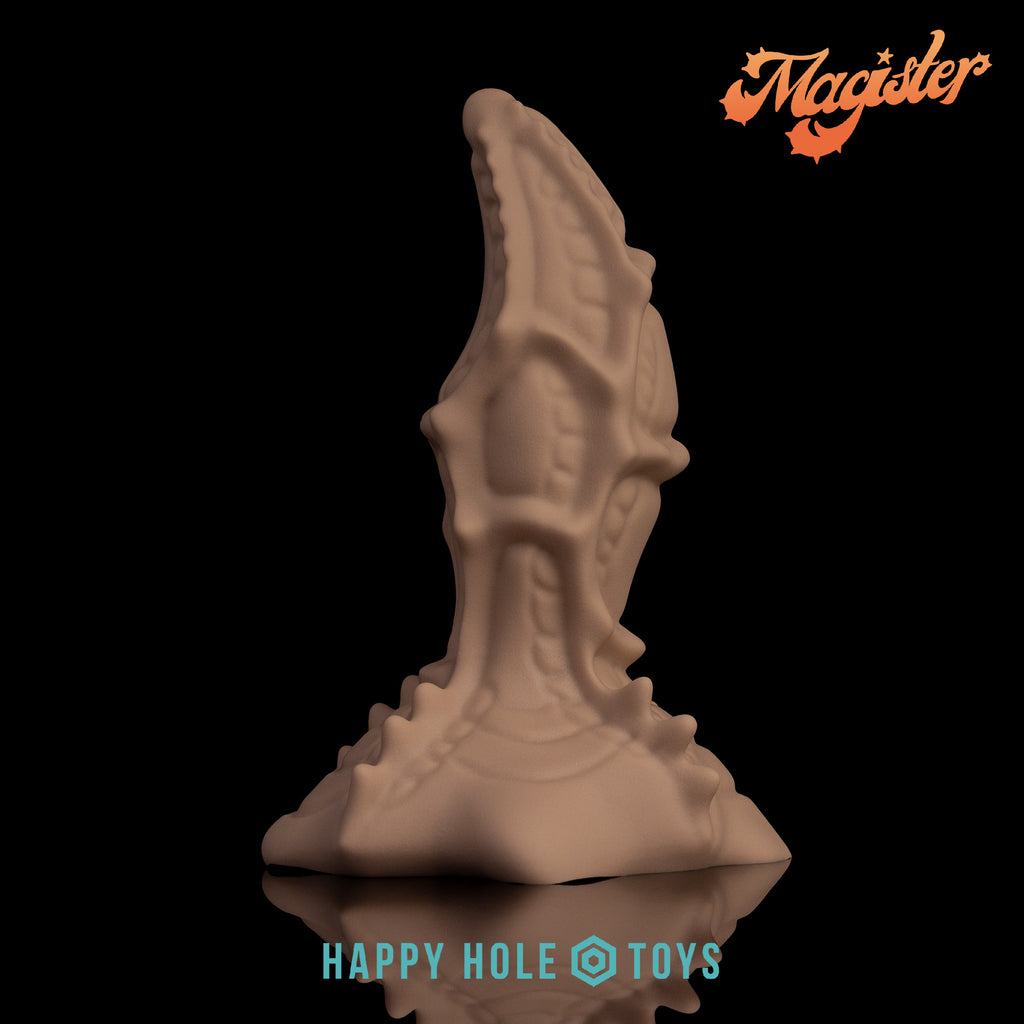 A Magister dildo in Sandrift, a sandy tan flesh-like color, on a black background. More in product description.