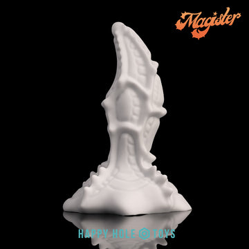 A Magister dildo in Tapioca, a soft, clean white, on a black background. More in product description.