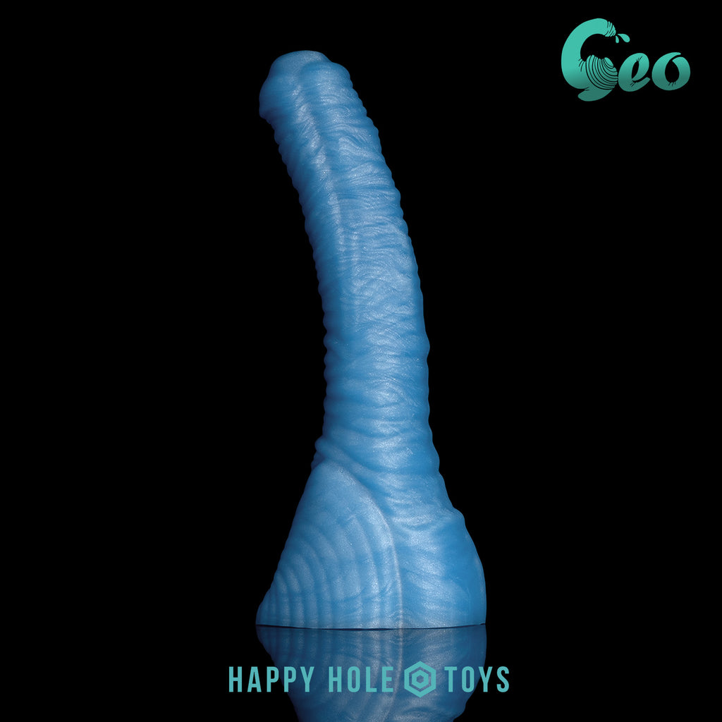 A Geo dildo in UV Sparkle Blue, a vibrant blue with mica swirls, on a black background. More in product description. 